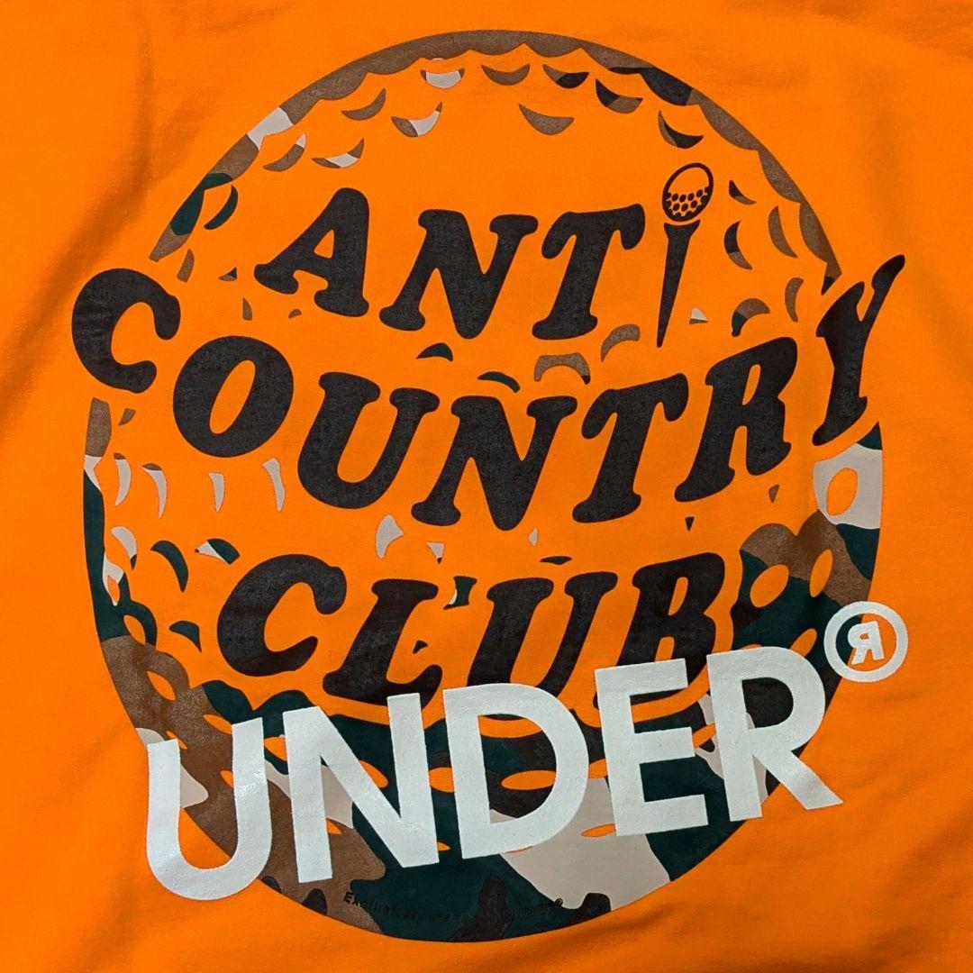 ANTI COUNTRY CLUB ✕ UNDER フーディ オレンジ ANTI COUNTRY CLUB ✕ UNDER フーディ オレンジ（アンチ